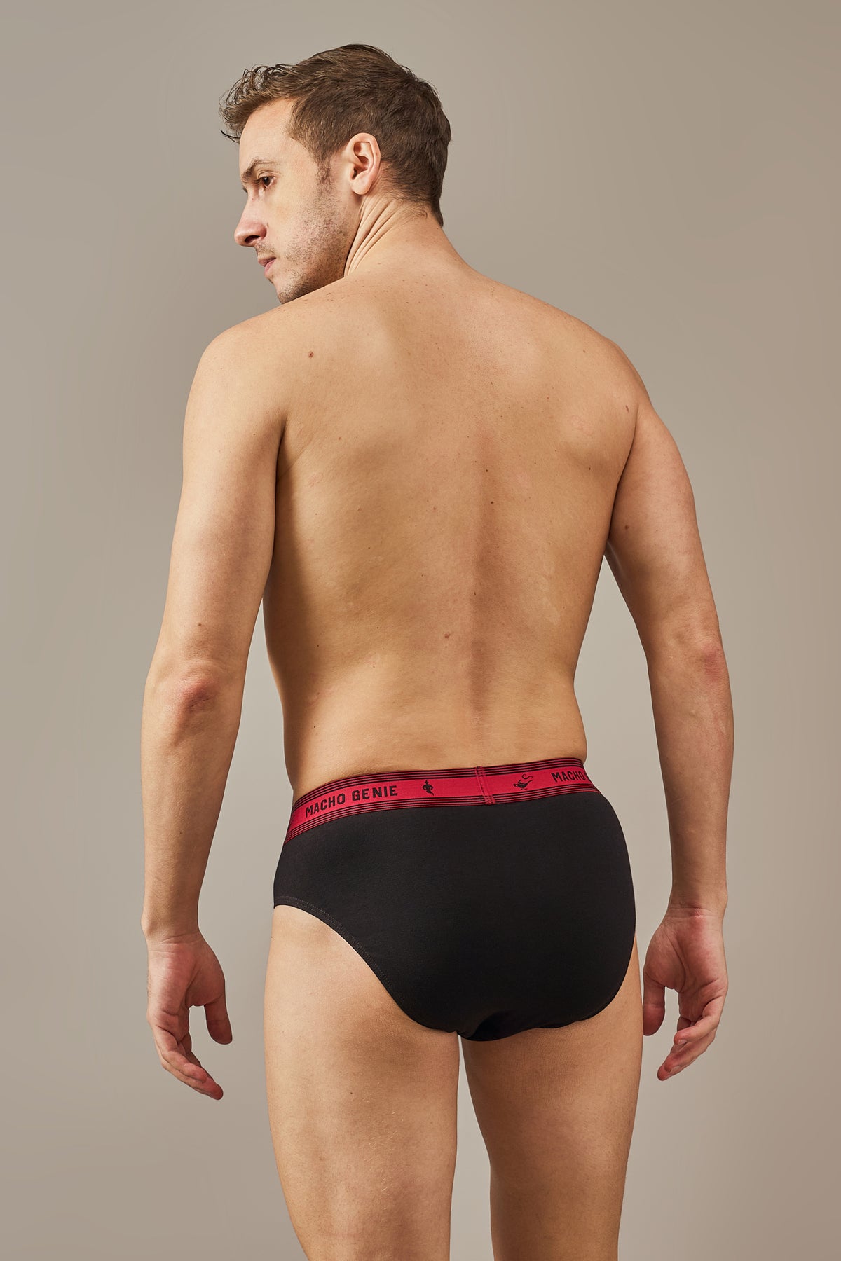Macho Genie Bold Impressions men's cotton briefs shown from the rear, highlighting the full-coverage back, clean finish, and stretch waistband in Raven Black