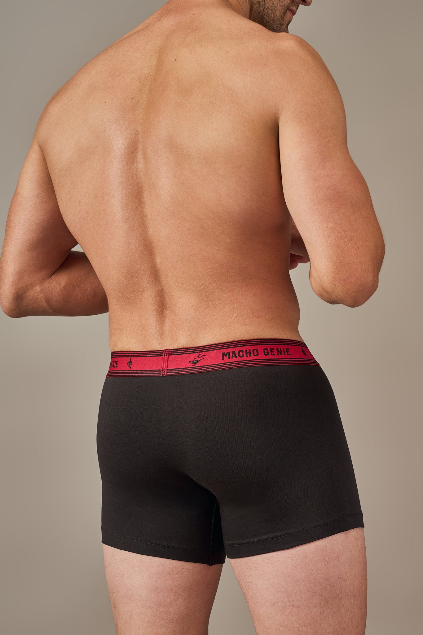 Macho Genie Bold Impressions men's cotton trunks shown from the back with full coverage, a 3-inch inseam, and supportive stretch waistband in Raven Black color
