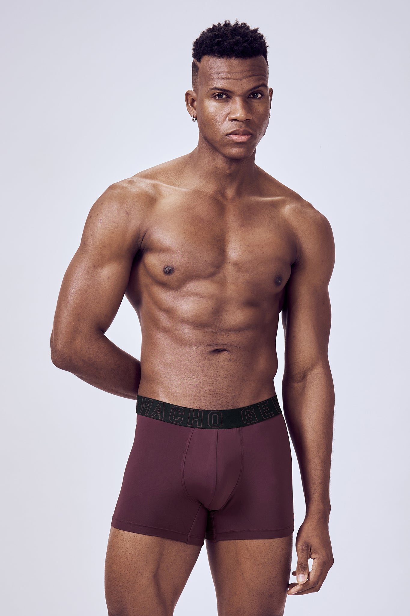 Macho Genie Wine Evercore Performance Compression Trunks shown in a full-body close-up, highlighting the smooth finish and streamlined athletic silhouette