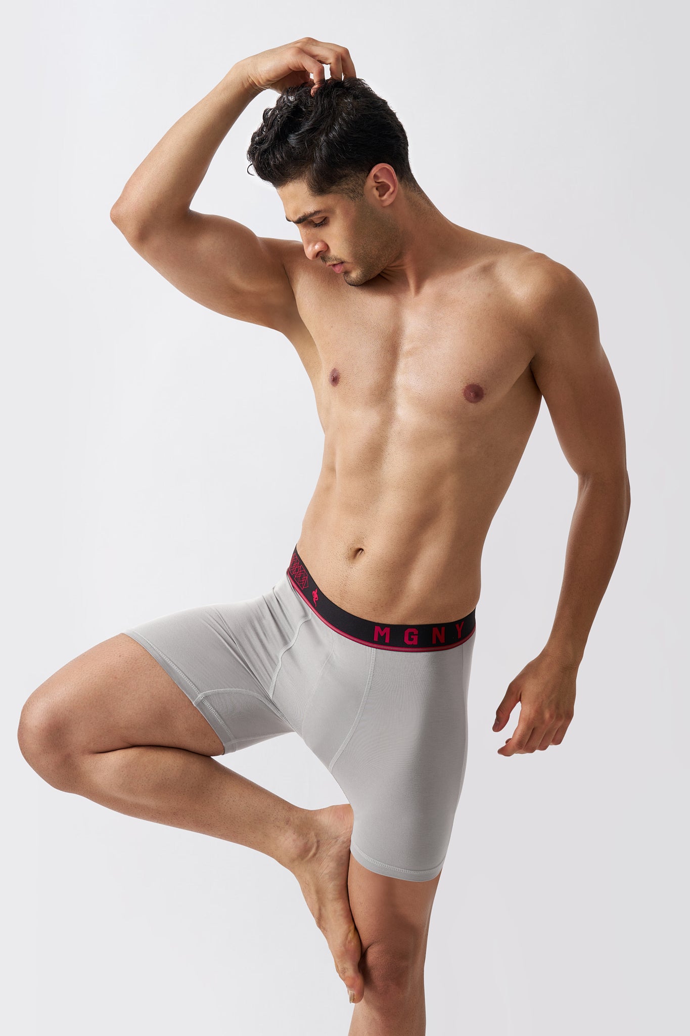 Macho Genie Grey men's bamboo boxer briefs showing flexible stretch and comfortable leg coverage during movement
