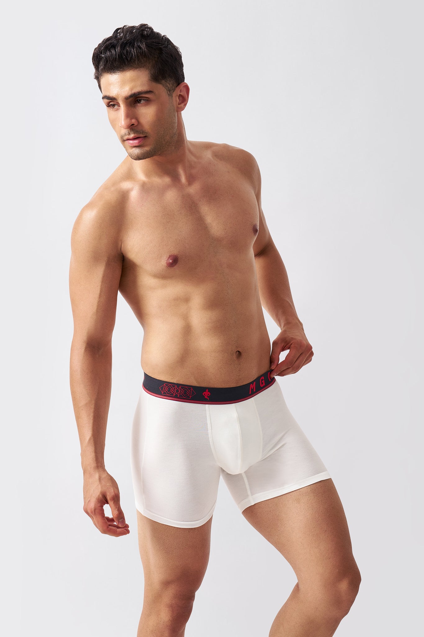 Macho Genie Ivory white men's bamboo boxer briefs shown in a relaxed pose, highlighting flexible stretch and longer leg coverage