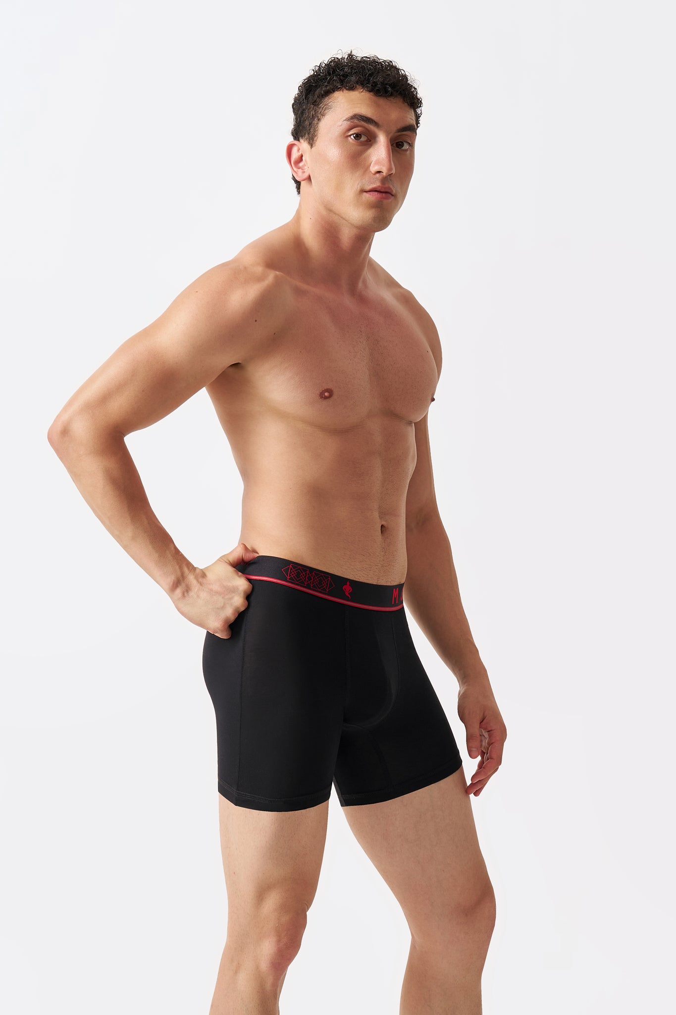 Macho Genie Jet Black men's bamboo boxer briefs shown in side profile with a flexible stretch waistband and smooth close-to-body fit