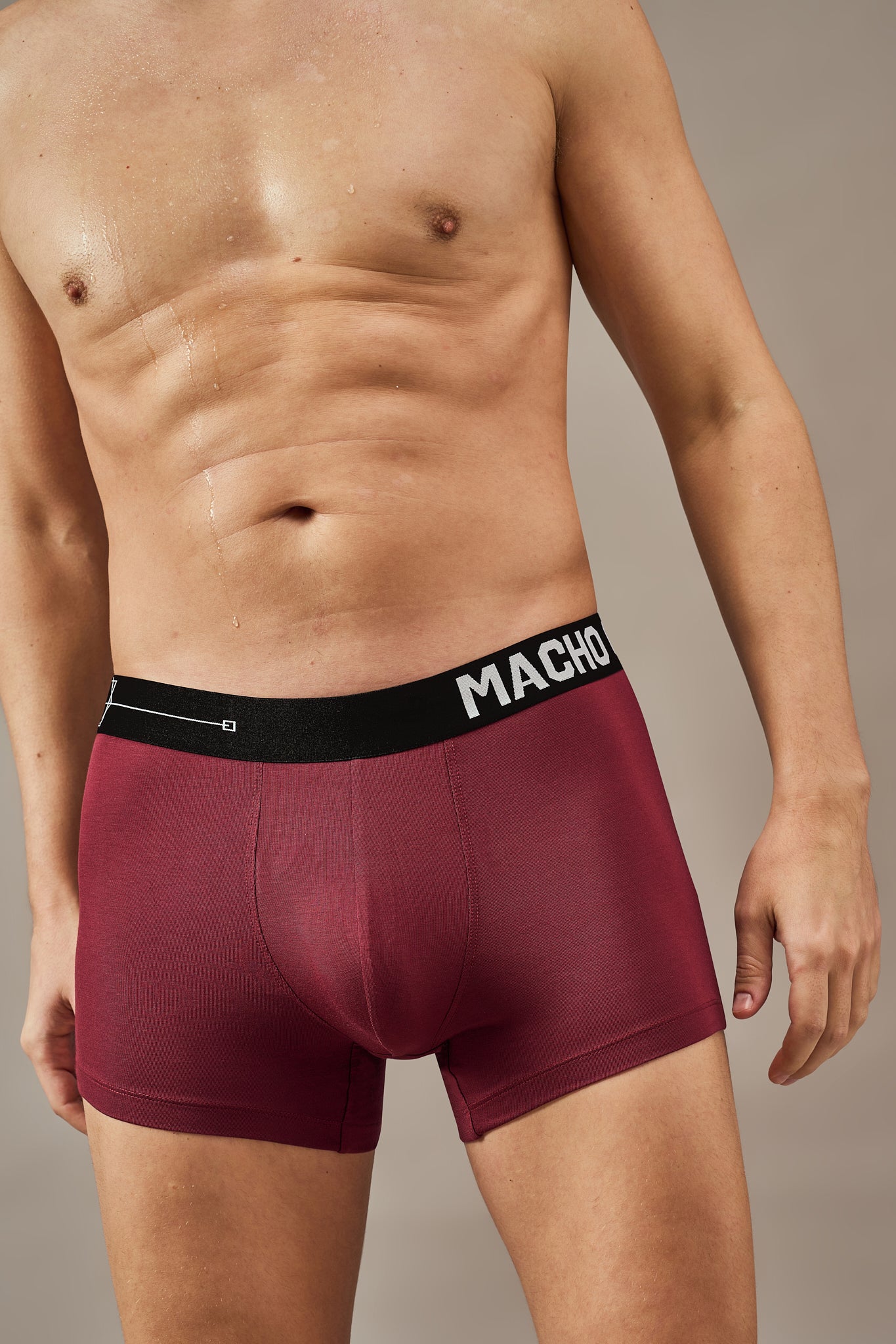 Macho Genie premium maroon modal trunks shown in a close-up, highlighting the flexible waistband, ultra soft bio washed modal fabric and tailored 3 inch seam