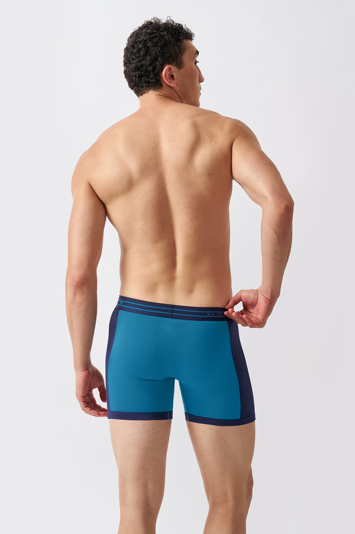 Back view of Macho Genie men's blue cotton boxer briefs with a stretch waistband and 6 inch inseam
