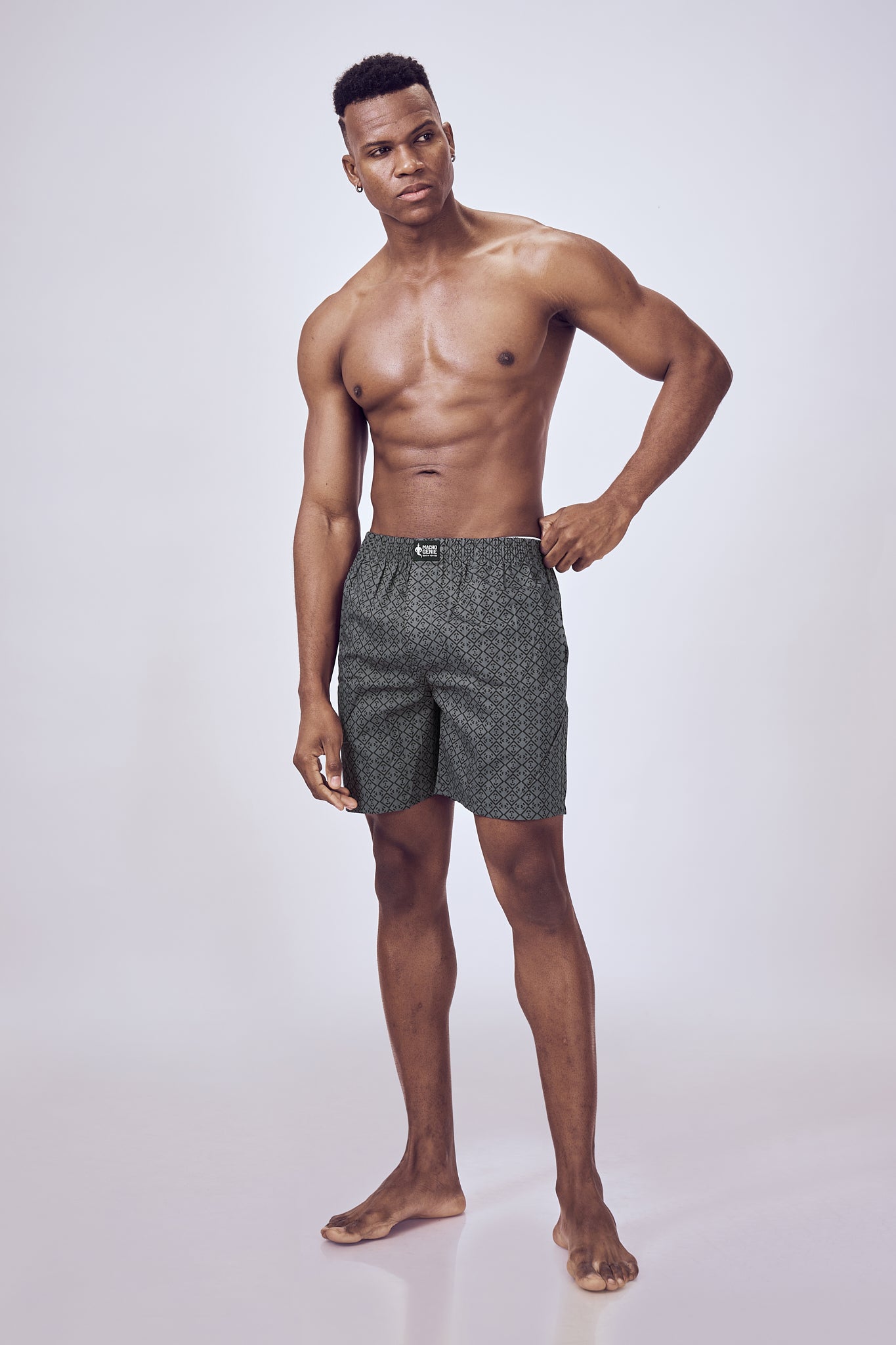 Macho Genie men’s printed charcoal gray cotton woven boxers with 100% pure cotton construction, flexible waistband, with pockets and six inch inseam.