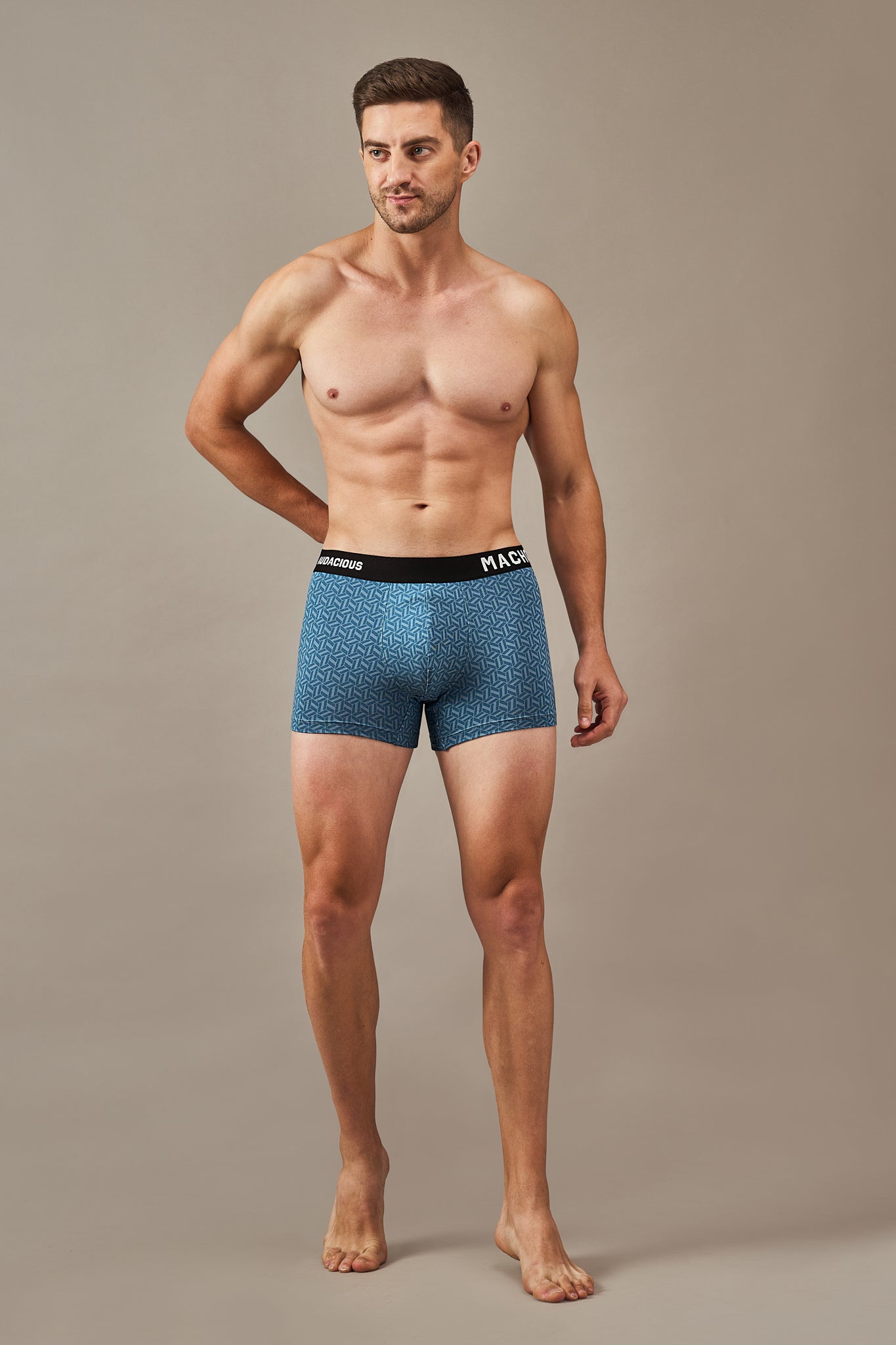 Macho Genie men’s vibrant blue modal trunks featuring ultra soft fabric, flexible waistband, geometric prints and three inch inseam