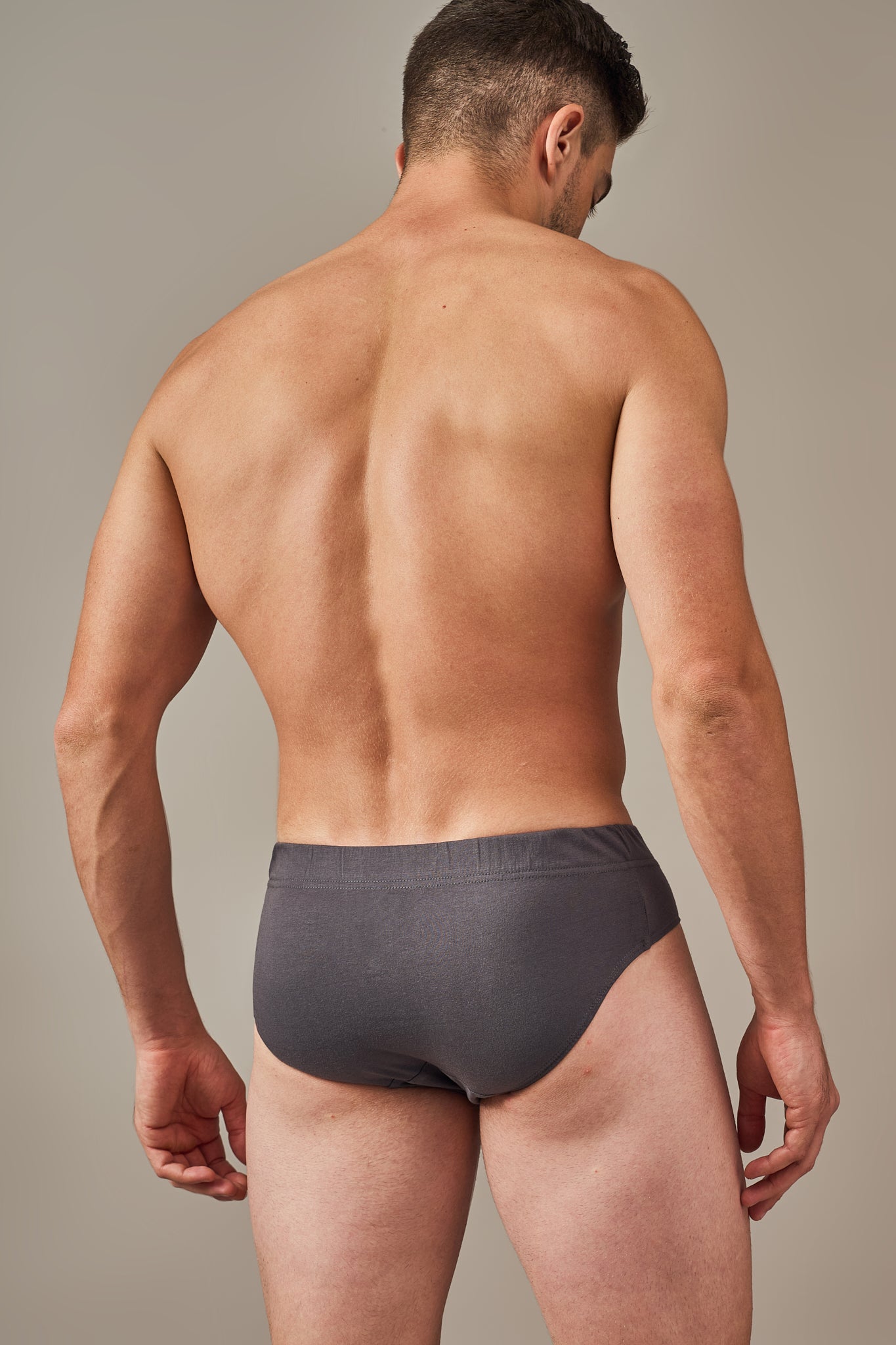 Back view of Macho Genie 100% cotton Y-shaped briefs in Slate Grey showing the full coverage cut, soft breathable construction and secure fit designed to help prevent riding up.