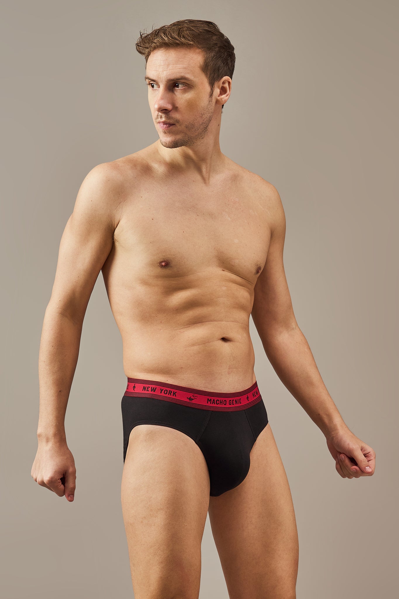 Macho Genie Bold Impressions men's Y-shaped cotton briefs shown from a close-up side angle, featuring a contoured pouch, full-coverage cut, and Raven Black fabric