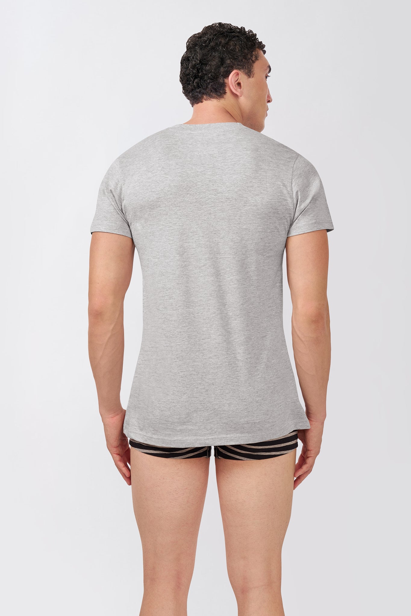 Back view of a Macho Genie AeroCot Base+ men's gray cotton V-Neck undershirt showing the smooth back, short sleeves and fitted full-length silhouette