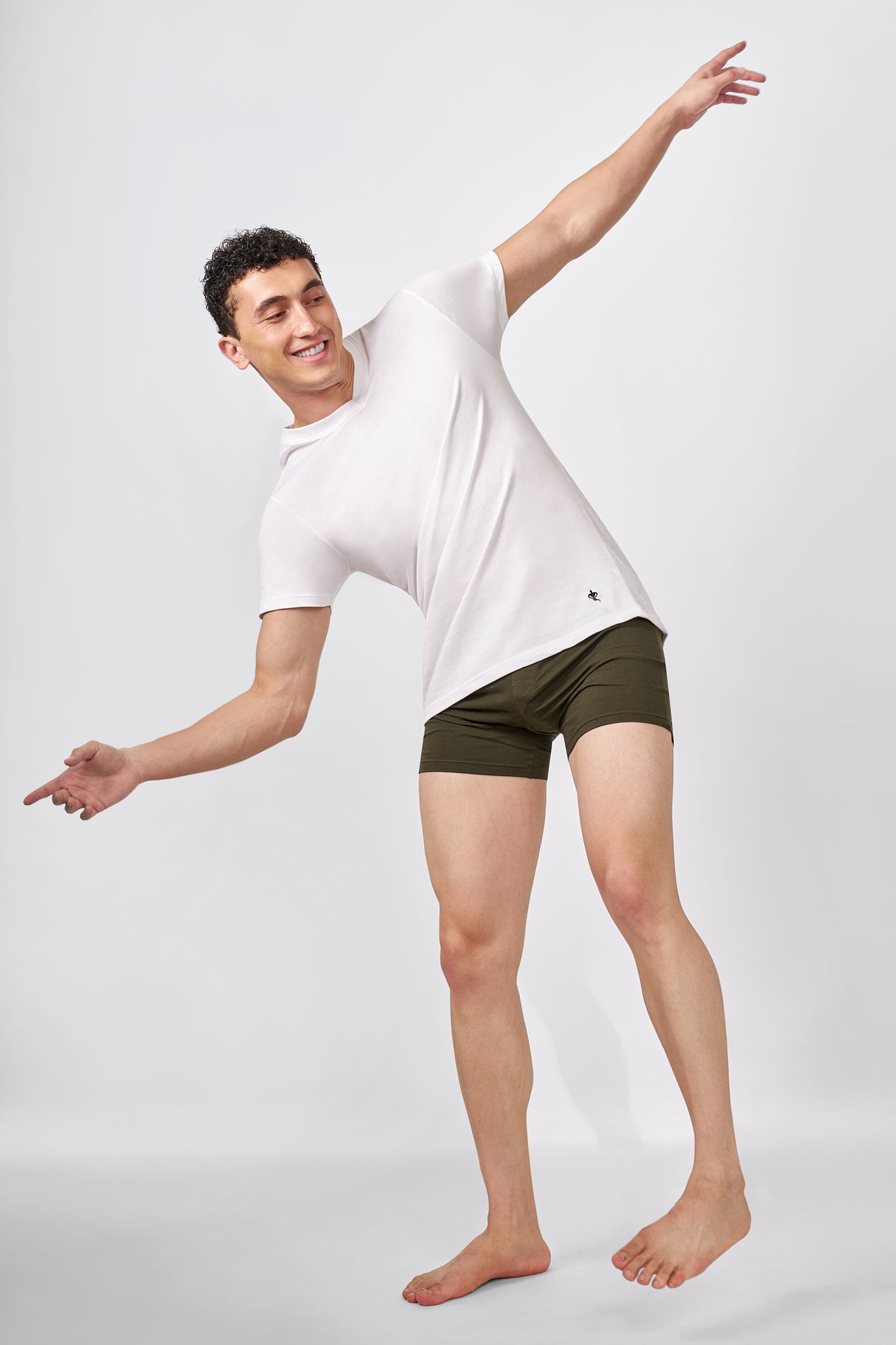 Macho Genie AeroCot Base+ white V-Neck undershirt worn during movement, showing its comfortable flexible fit