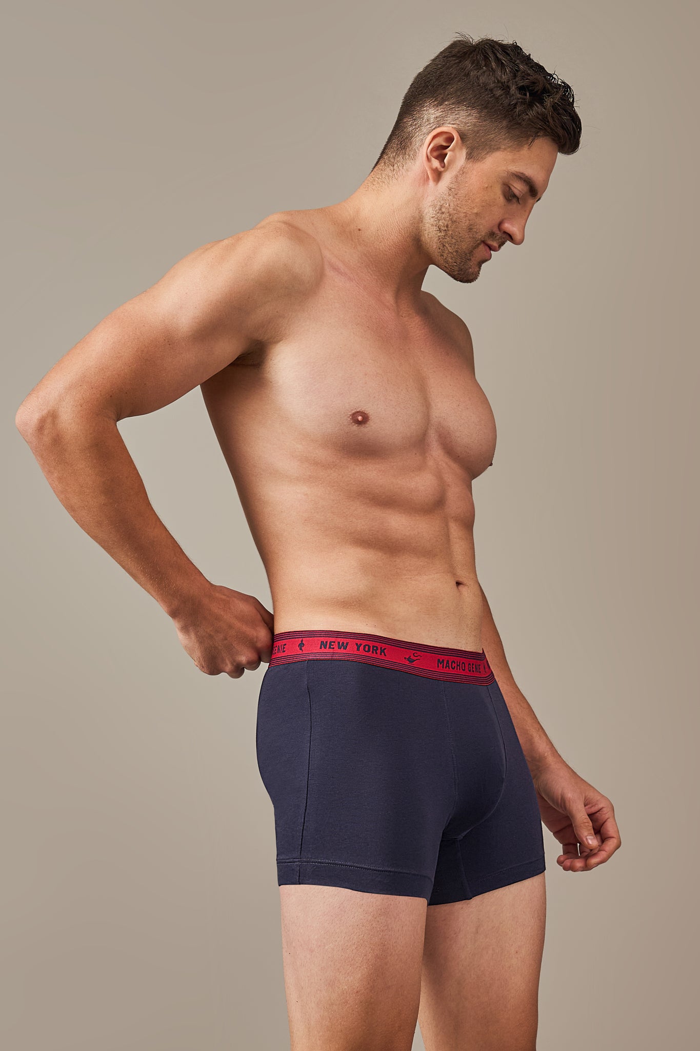 Macho Genie Bold Impressions cotton trunks displayed in side profile with clean finished seams, ergonomic construction, and a fuller pouch shape, midnight navy