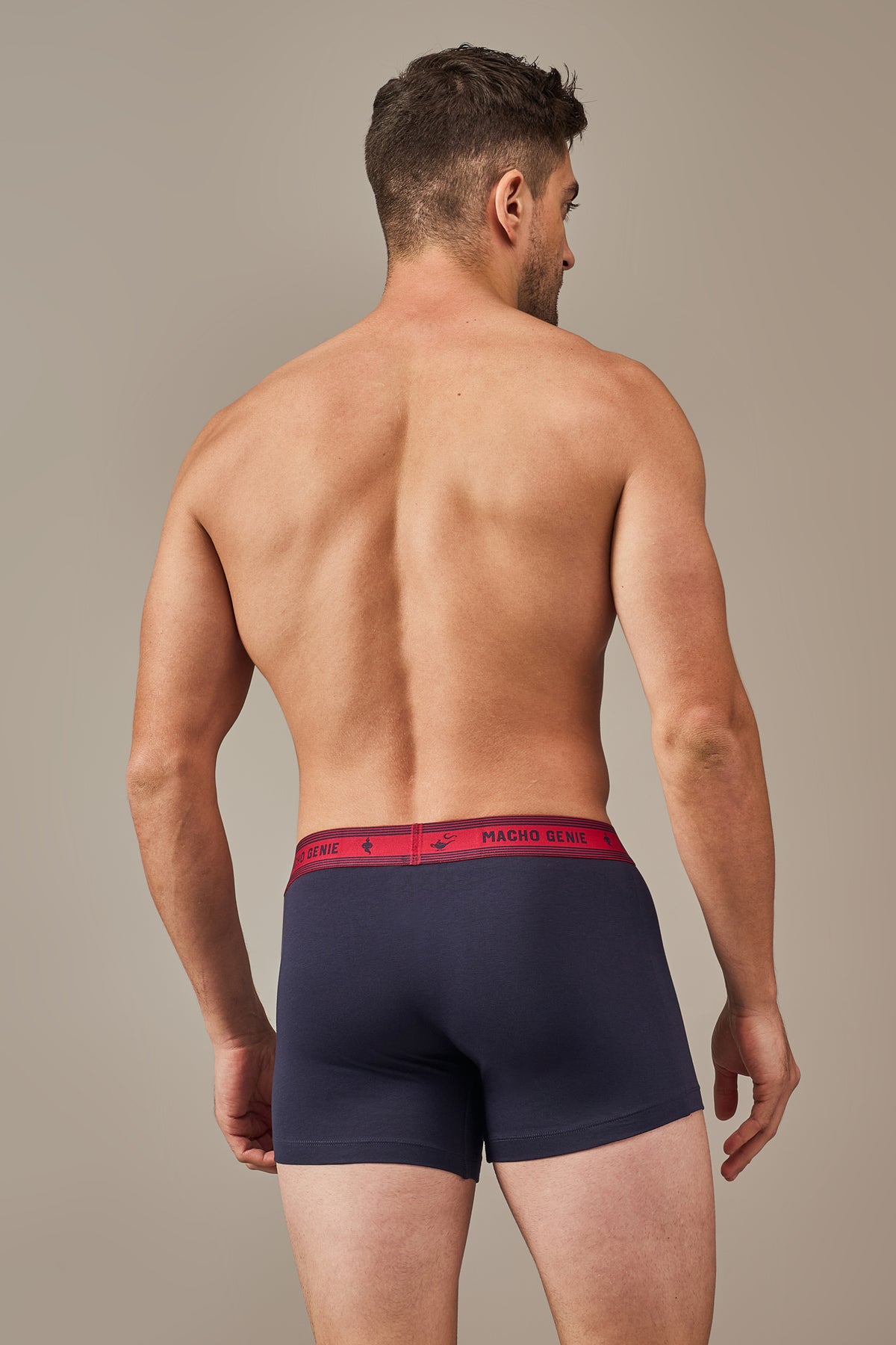 Macho Genie Bold Impressions men's underwear photographed from the back with a smooth full-coverage seat, secure waistband, and stay-put construction in midnight navy
