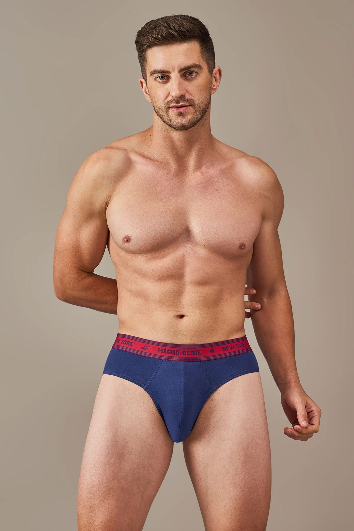 Macho Genie Bold Impressions Y-shaped briefs in Midnight Navy shown from the front, highlighting the structured pouch, smooth cotton fabric, and branded waistband