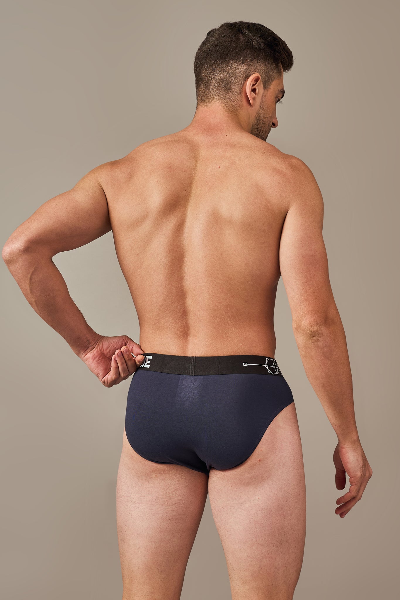 Macho Genie deep navy modal briefs shown from the back, highlighting smooth full coverage, premium soft fabric and a secure flexible waistband designed to stay comfortably in place
