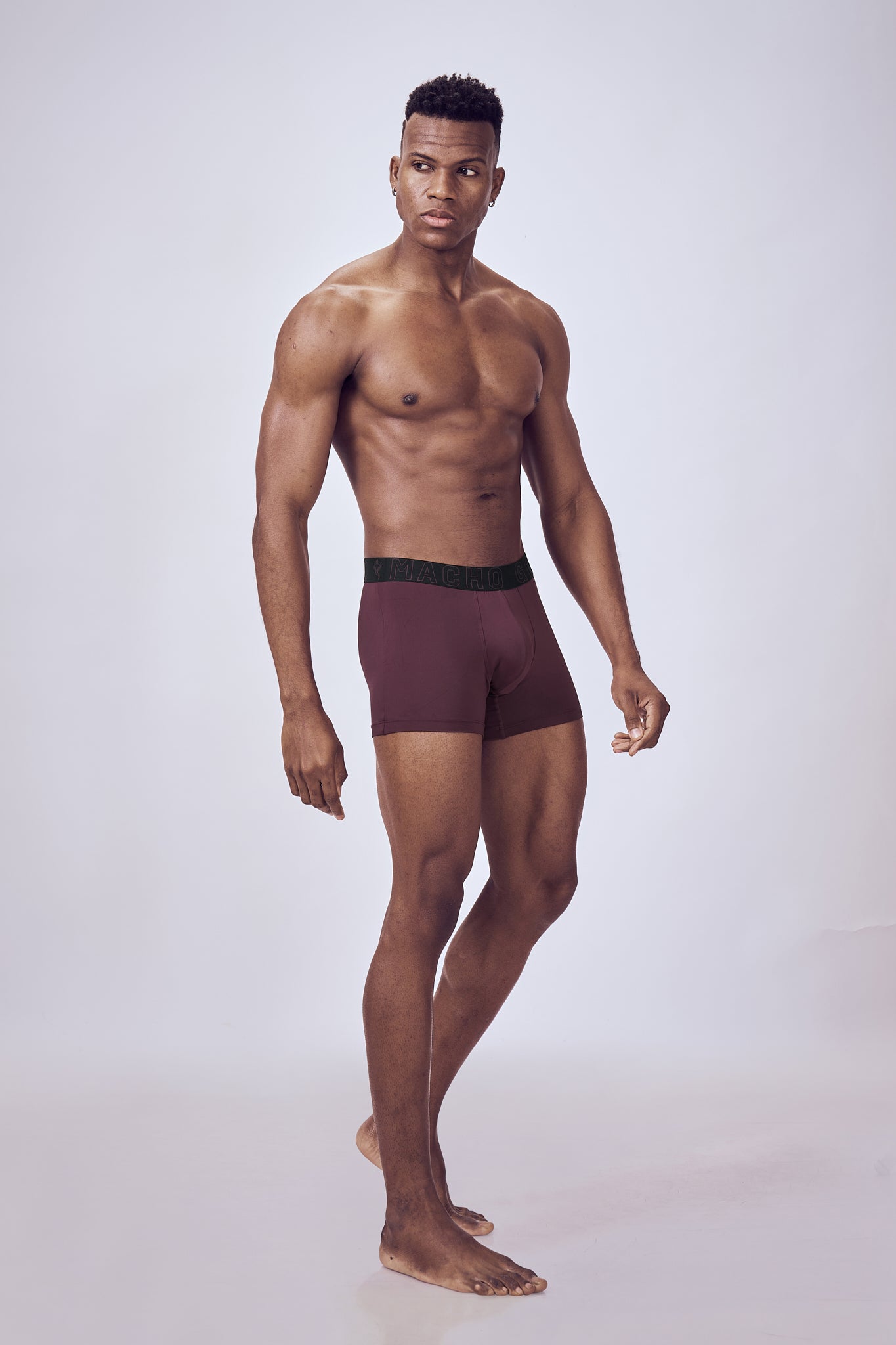Macho Genie Wine Evercore Performance Compression Trunks shown in a full-body view highlighting the smooth finish and streamlined athletic silhouette
