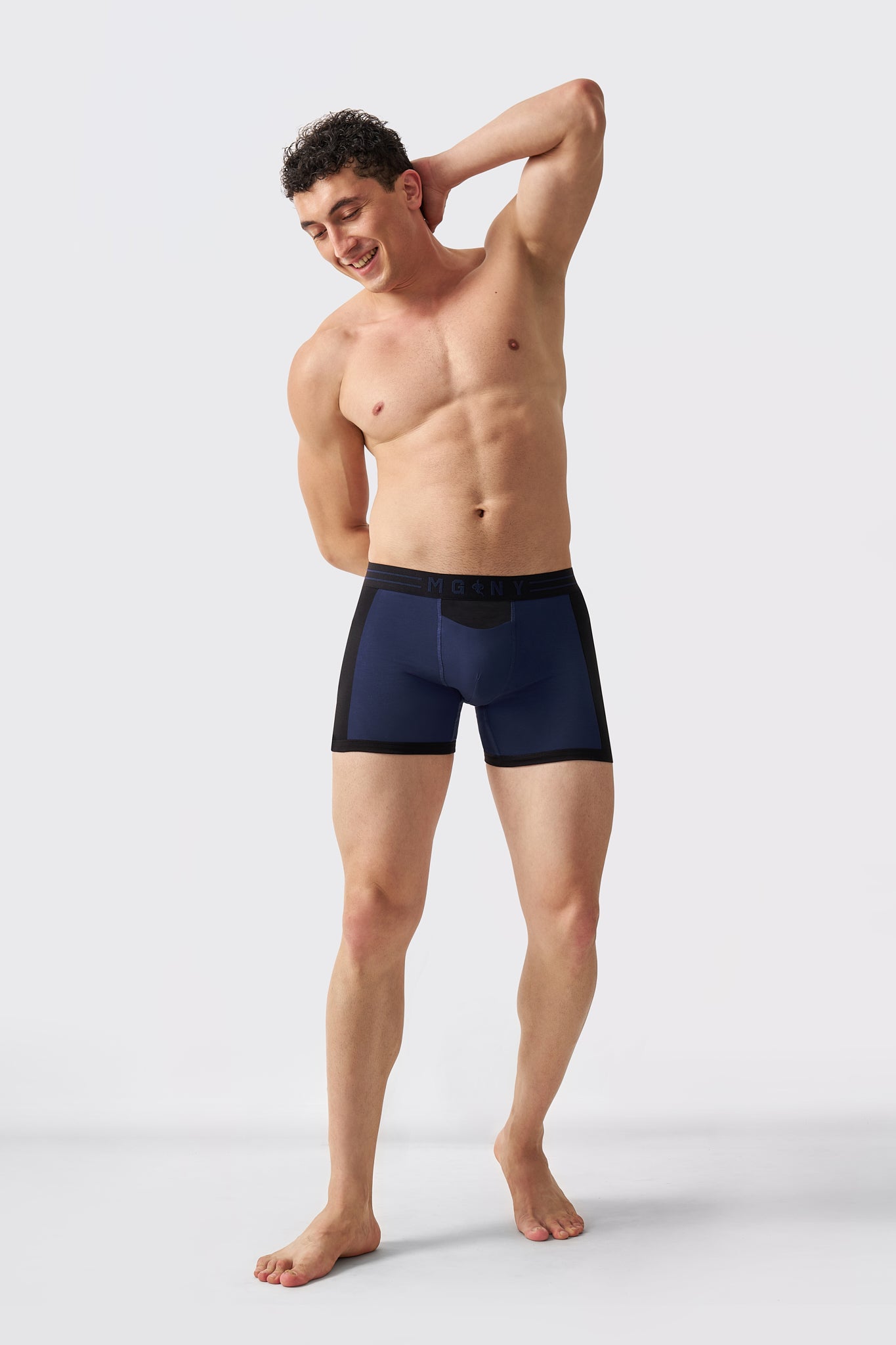 Man wearing Macho Genie navy cotton boxer briefs designed for everyday wear and flexible movement